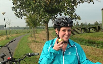 Enjoying a juicy pear from a friendly farmer's orchard that lines the bike path. (submitted by Natalie123)