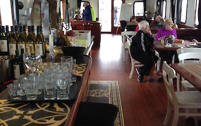 A view from the dining area through the bar and sitting area. Our fellow travelers are relaxing between ride time and dinner. (submitted by Natalie123)