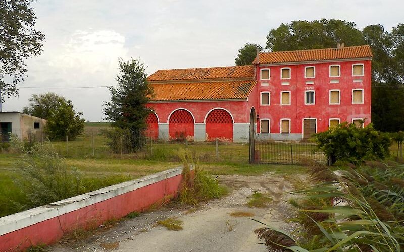 Red farm house and fence, Italy. (submitted by Two Michiganders)