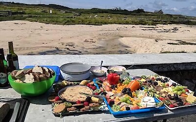 A sumptuous snack beachside. From fresh fruits and veggies to seafood pates, hearty breads and wine/beer/water, we were well served. (submitted by MarcieB)