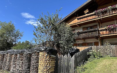 Lovely stream side bicycle path out of San Candido to Sesto passed rural chalets with a winter stockpile of wood. (submitted by Marcie B.)