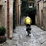 Cycling in medieval town (photo by StuNH)
