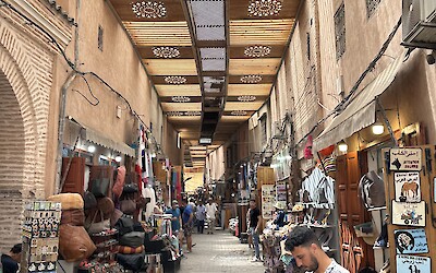 An alley filled with colorful shops selling jewelry, clothes, belts, and endless other trinkets (submitted by A. Anderson)