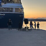 Local children playing at sunset next to our dock-neighbor in Poros (photo by Mary B)