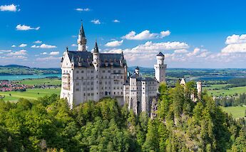 Neuschwanstein Castle, perched on a forested hill, Germany. Timo Volz@Unsplash