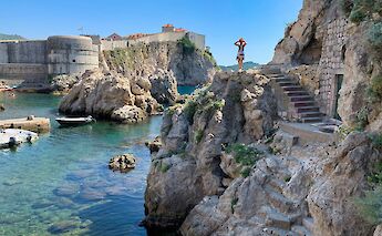 Standing on the rocks in Dubrovnik, Croatia. Unsplash@Datingjungle