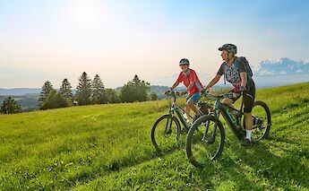 Cycling through hills on e-bikes. Uwe Moser@iStock