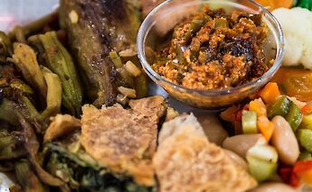 Speca të ferguara (roasted peppers) served with pite. CC:Kevin Rechts