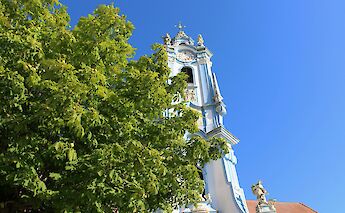 Tower viewed through foliage, Wachau, Austria. Unsplash:Daniela Turcanu