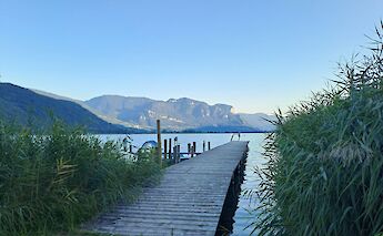 Jetty over Lake Kalterersee, Italy. Unsplash:Stefania Tolin