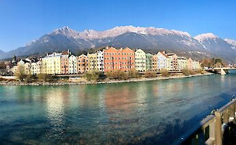 Row of buildings in front of a row of mountains, Innsbruck. Austria. Unsplash:Sarah Donisi