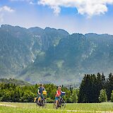 Cycling with the mountains behind, Salzburg Lakes, Austria. CC:TO