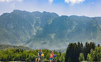 Cycling with the mountains behind, Salzburg Lakes, Austria. CC:TO