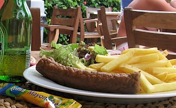 Frikandel with fries, a favorite Dutch delicacy. CC:Guusbosman