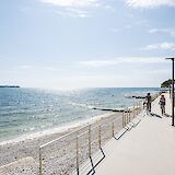 Cycling along the sunlit Adriatic shoreline. toFA