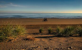 Riding bikes on the beach in Jesolo. Giovanni@pexels