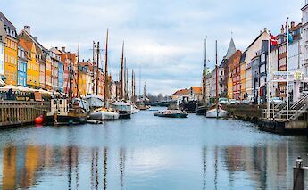 Boats with masts, Copenhagen, Denmark. Unsplash:Ava Coploff