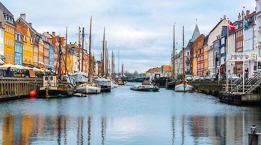 Boats with masts, Copenhagen, Denmark. Unsplash:Ava Coploff