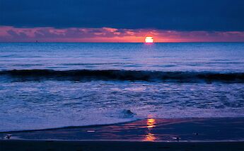 Sunset in Royan, France. Unsplash:Didier Veillon