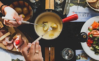 Fondue is a favorite among the Swiss. Angela Pham, Unsplash