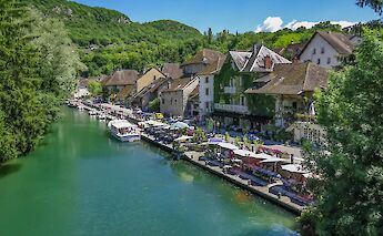 Riverside restaurants in Chanaz, France. Unsplash:Free Nomad