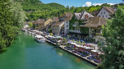 Riverside restaurants in Chanaz, France. Unsplash:Free Nomad