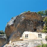 Windows in the cliff at Les Eyzies-de-Tayac-Sireuil, France. Unsplash:vigouroux gerald