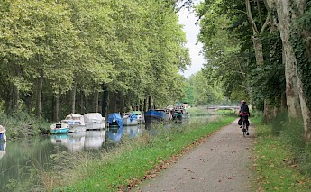 Biking along the Garonne River Canal from Bordeaux to Toulouse, France.