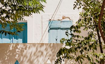 Blue door and shutters, Les Baux de Provence, France. Unsplash:Laura Adai