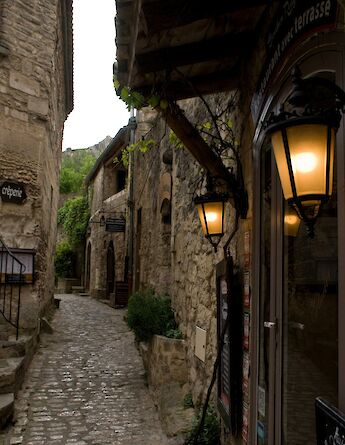 Lamps outside a doorway in Les Baux de Provence, France. Unsplash:Klaus Kreuer