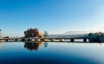 Bridge over Lake Geneva, Switzerland. Unsplash:Steve Lussier