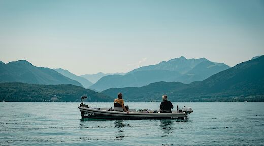 Fishermen on Lake Annecy, France. Unsplash:Guillaume Coupy