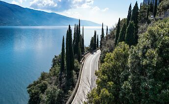 Road winding past Lake Garda, Italy. Unsplash@Elisabetta Falco