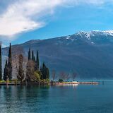 Tranquil treeline, Lake Garda, Italy. Unsplash@Julia Boiun