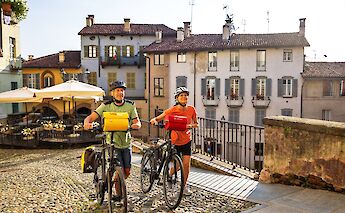 Pushing the bikes through Saluzzo, Piedmont, Italy. CC:TO
