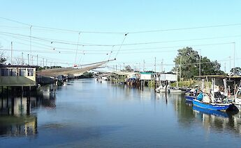 Fishing boats in Comacchio, Italy. Unsplash@Giovanni Ravazzolo