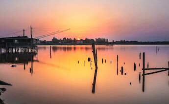 Sunset in Comacchio, Italy. Unsplash@Samuele Bertoli