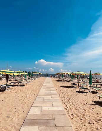Walkway to the beach, Ravenna, Italy. Unsplash@Luca Basili