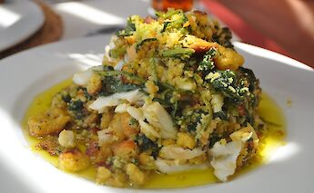 Traditional Portuguese dish of shredded bacalhau, migas & rapini! CC:silvar.net