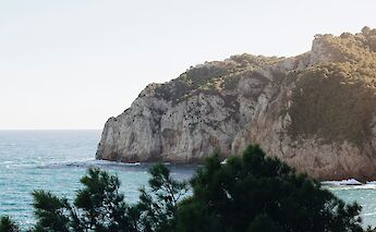 Viewing the coast of Begur through branches, Spain. Unsplash:Mael Balland