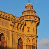 Golden stone building in Sant Feliu de Guixols, Spain. Unsplash:Marti Sierra