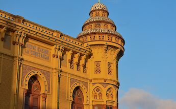 Golden stone building in Sant Feliu de Guixols, Spain. Unsplash:Marti Sierra