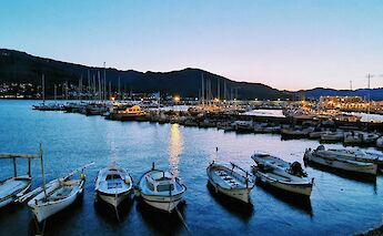 Night falling on the harbor, Girona, Spain. Unsplash:Julien Paoletti