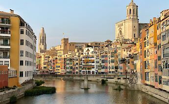 Yellow and orange buildings along the river, Girona, Spain. Unsplash:Christian Hess Araya