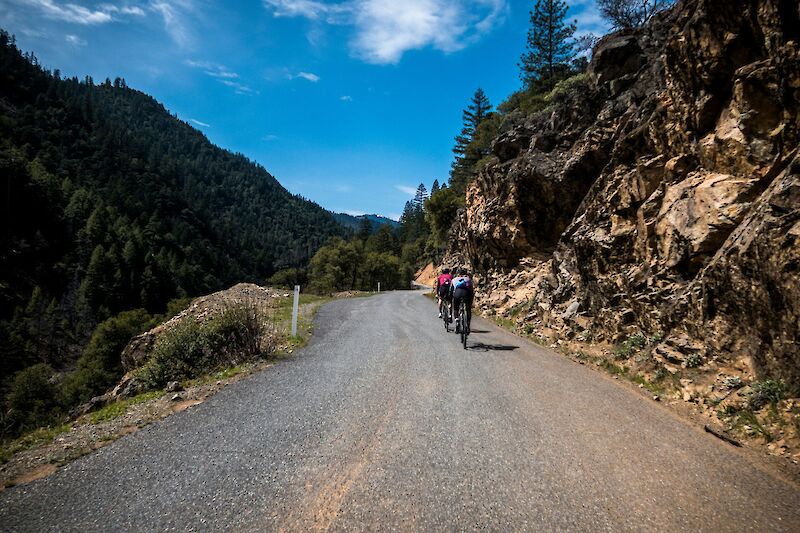 Cycling along mountain roads. Unsplash@Ben Guernsey