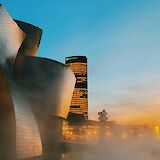 Mist around the Guggenheim Museum at sunset, Bilbao, Spain. Unsplash:Anastasiia Rozumna