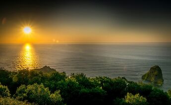 Sunset over the sea in San Juan de Gaztelugatxe, Spain. Unsplash:Aitor Olaskoaga