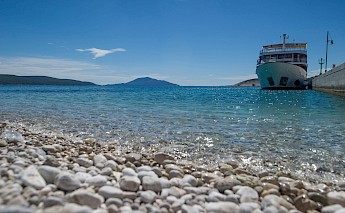 Ship awaits in Kvarner Bay, Croatia.