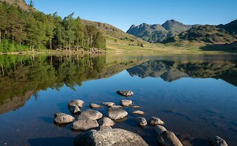 Stones in the lake in Ambleside, Lake District, England. Unsplash@Jonny Gios