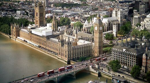 Aerial view of Westminster Palace and adjacent Big Ben, London, England. Unsplash:Maxim Melnikov